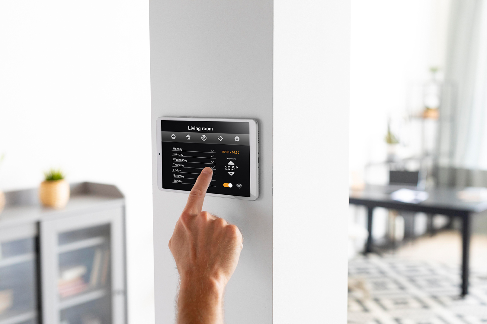 man using tablet his smart home